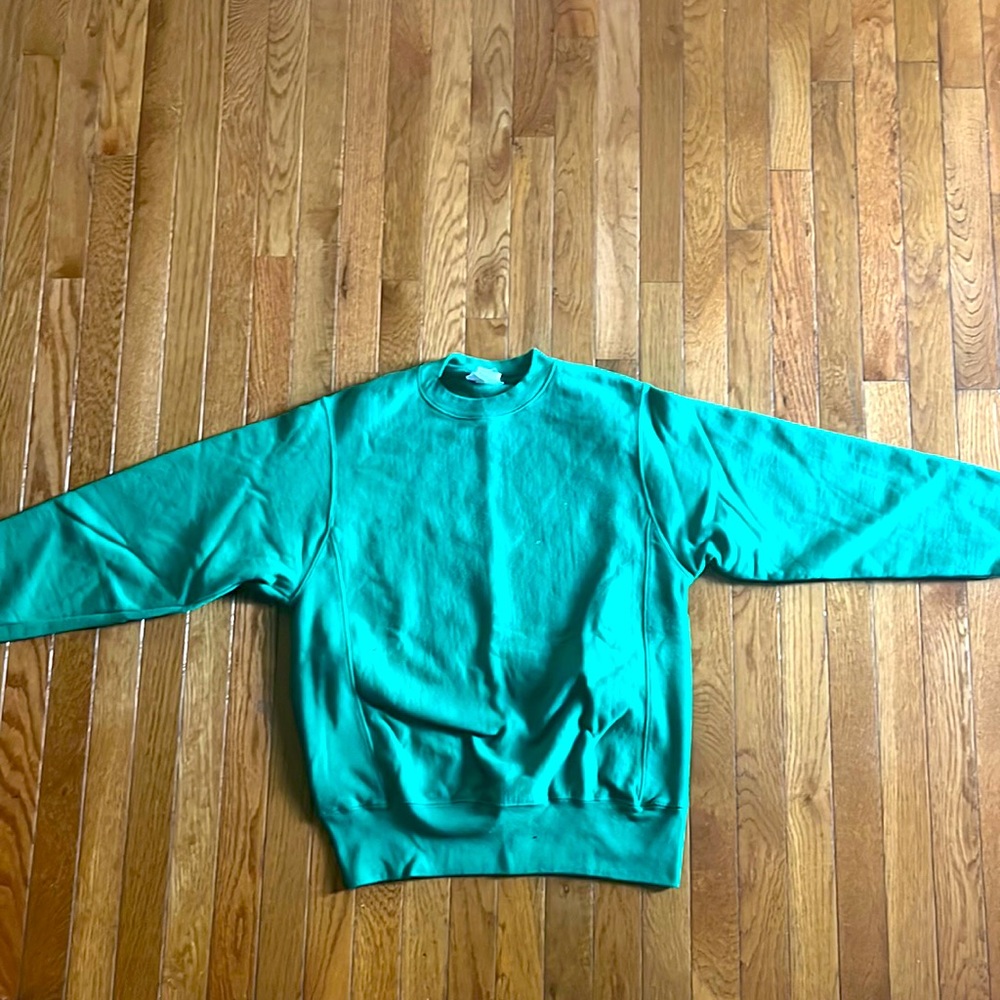 This is a green crewneck from champion.
